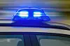 Polizeiauto mit Blaulicht.