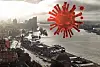 Blick auf die Elbphilharmonie Hamburg, daneben montiert eine Coronavirus-Illustration