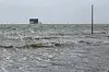 Steigendes Wasser überflutet den Strand von St. Peter-Ording.