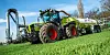 Ein Feld wird mithilfe eines Traktor gedüngt (Symbolbild).