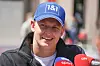 Formel 1-Fahrer Mick Schumacher lächelt in Richtung Kamera