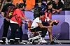 Malaika Mihambo wird mit Rollstuhl aus dem Stadion gefahren