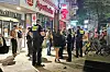 Polizisten und Sanitäter am Einsatzort am Mühlenkamp