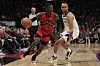 Dennis Schroder dribbelt gegen Minnesota Timberwolves Stürmer Kyle Anderson