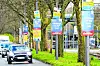 Wahlplakate der Bürger in Wut und anderer Parteien hängen in Bremen am Straßenrand.
