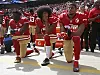 Colin Kaepernick kniet