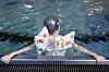 Kind mit Schwimmflügeln