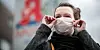 Eine Frau mit Mundschutz: Das Coronavirus breitet sich aus.