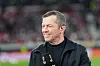Lothar Matthäus mit einem Mikrofon in der Hand
