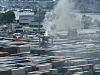 Ein Van Carrier steht auf dem Containerterminal Tollerort in Flammen.