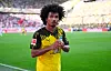 Karim-David Adeyemi jubelt im gelb-schwarzen Dortmund-Trikot auf dem Rasen.