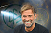 Jürgen Klopp vor DFB-Logo und Bundesadler als Fotomontage zum möglichen Bundestrainer-Wechsel.