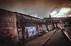 Verlassener Waagenbau an der Sternbrücke mit Graffiti und dramatischem Himmel vor dem Abriss.