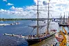 Historische Segelschiffe laufen im Stadthafen Rostock zur Hanse Sail aus.