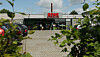 Auf dem Rewe-Parkplatz auf dem Königslande 63 griff der Angeklagte das Opfer mit einer Axt an. (Symbolbild)