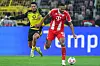 Felix Nmecha und Jonathan Tah kämpfen im Signal Iduna Park um den Ball.