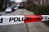 Polizeiabsperrband versperrt den Blick auf eine unscharfe Straße in Hamburg-Billstedt.