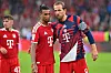 Harry Kane und Michael Olise gehen nach Bayerns 5:1-Sieg gegen Stuttgart durch die Allianz Arena.