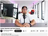 Jean Pierre Kraemer spricht in einem hellen Büro in ein Mikrofon; darunter ist ein YouTube-Videotitel zu sehen.
