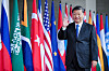 Xi winkt