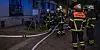 Feuerwehrmänner vor dem Haus an der Kanalstraße.