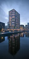So soll es einmal aussehen: Das Holzhochhaus „Roots“ in der HafenCity.