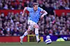 Kevin de Bruyne dribbelt mit dem Ball