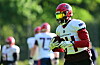 Malik Stanley mit einem Football in der Hand