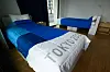Betten in einem Zimmer vom Olympischen Dorf