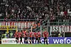 Spieler des AC Milan, im Hintergrund Fans