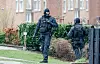 Polizeibeamte bei einer Razzia (Symbolbild).
